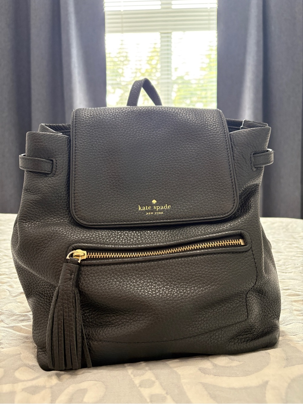 kate spade Black Pebbled Leather Tassel Backpack
